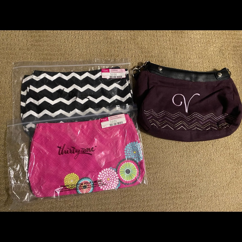 Thirty-One suite skirt purse with three skirts.